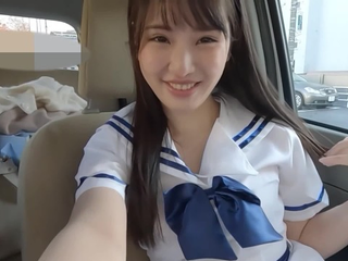 Steaming Chinese nubile with a nice face gives a driving palm-job & gets double penetrated in the car