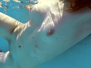 Curly-haired nubile with ideal backside and baps swims like a professional in the pool, gets moist and ultra-kinky!